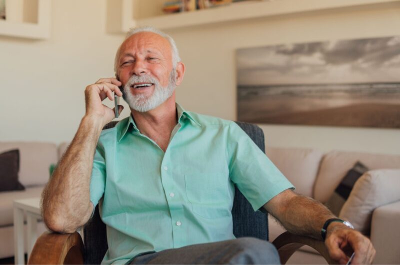 Man on cell phone talking about his career in real estate