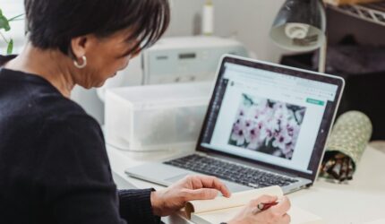 Lady at desk planning to improve her home before listing